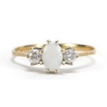 9ct gold opal and clear stone ring, size K, 1.1g :For Further Condition Reports Please Visit Our