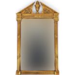 Ornate gilt framed wall mirror with bevelled glass and swan neck pediment, 128.5cm x 75.5cm :For