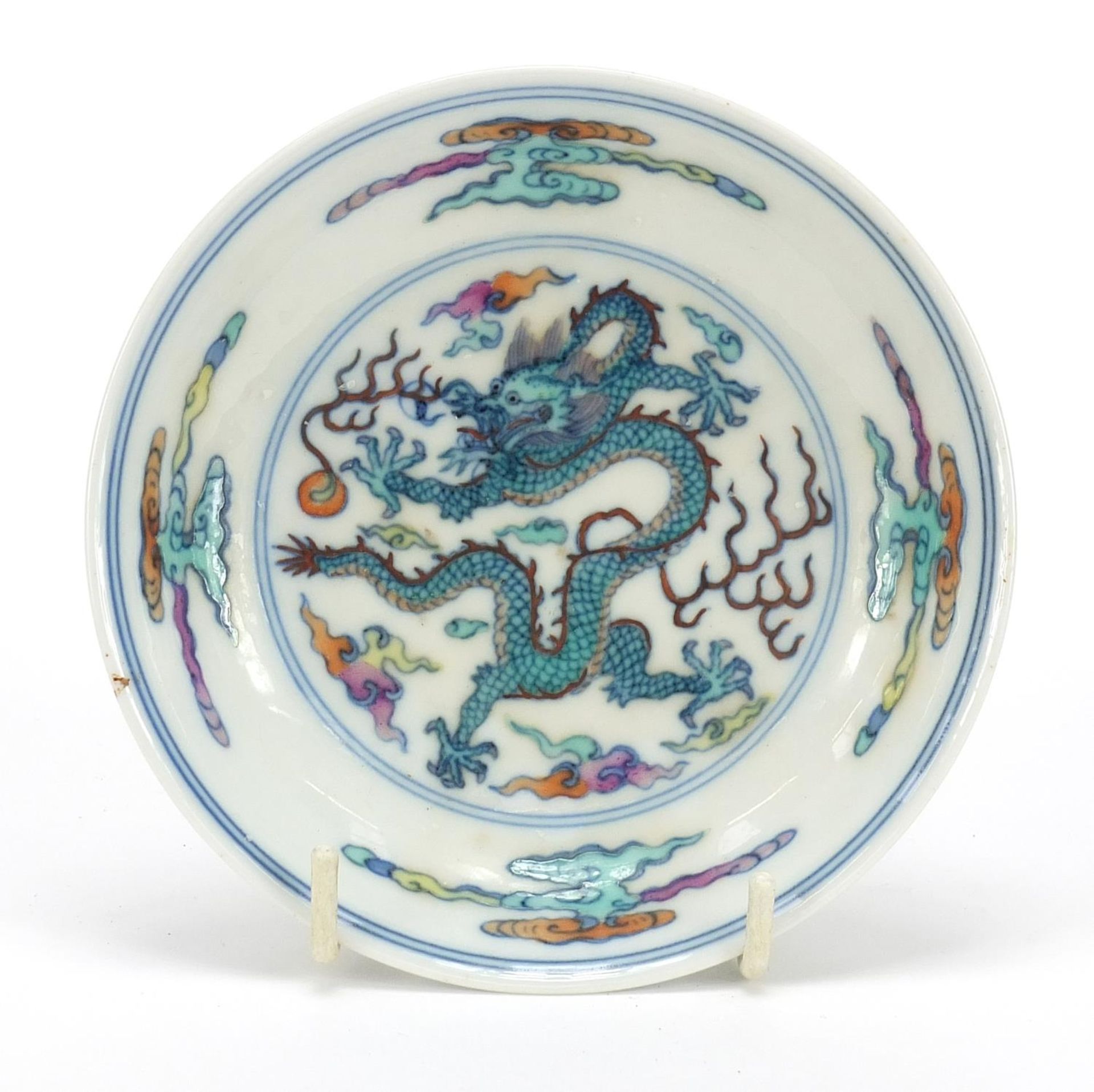 Chinese doucai porcelain dish hand painted with a dragon amongst clouds, six figure character