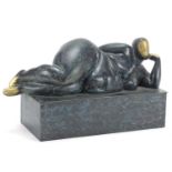 Mid century design patinated bronze sculpture of a reclining nude female, 30cm in length :For
