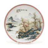 Chinese porcelain footed plate hand painted in the famille rose palette with two boats in a river