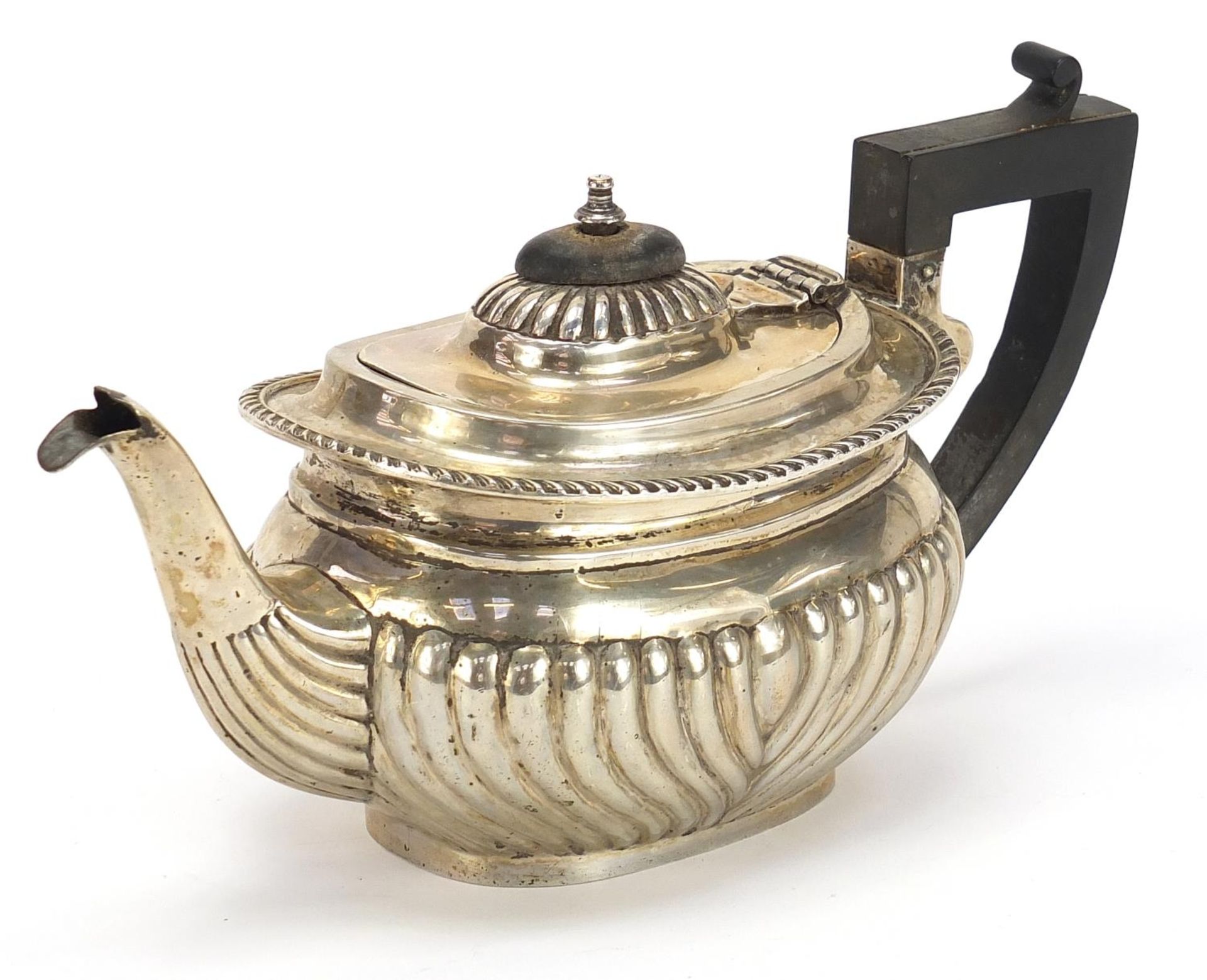 Thomas Hayes, Victorian silver teapot with demi fluted body and ebonised handle and knop, London