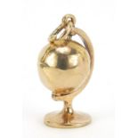 9ct gold rotating globe charm, 1.7cm high, 1.7g :For Further Condition Reports Please Visit Our