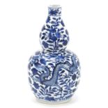 Chinese blue and white porcelain double gourd vase hand painted with a dragon amongst flowers,