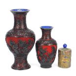 Two Chinese cinnabar lacquer vases and an enamelled brass three footed container, the largest 26cm