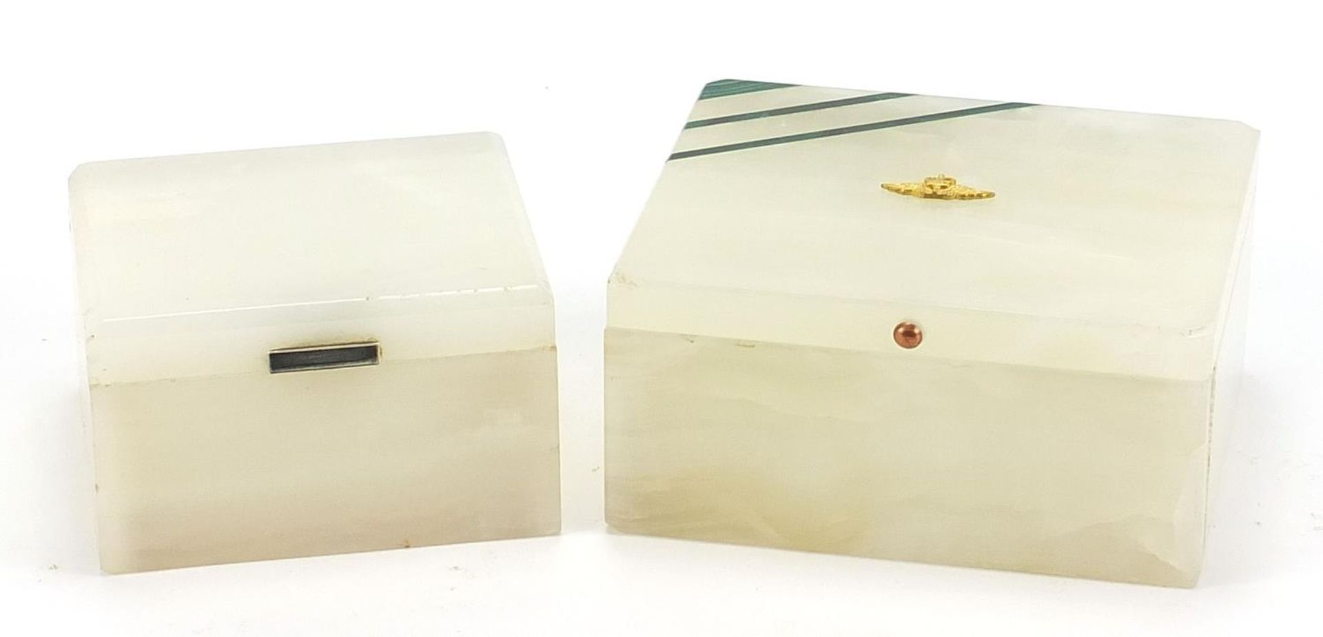 Two onyx cigarette boxes comprising one silver mounted and one with malachite inlay, the largest 6cm