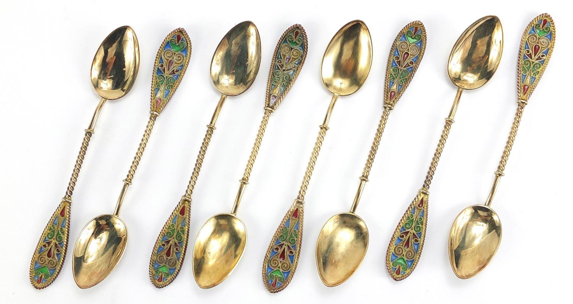 Johan G Kjaerland, set of eight Norwegian silver gilt and plique à jour enamel teaspoons housed in a