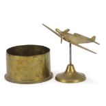 Military interest brass Spitfire and a trench art shell, the largest 20cm wide :For Further