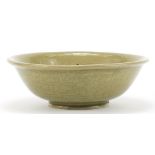 Chinese celadon glazed bowl incised with flowers, character marks to the base, 18cm in diameter :For