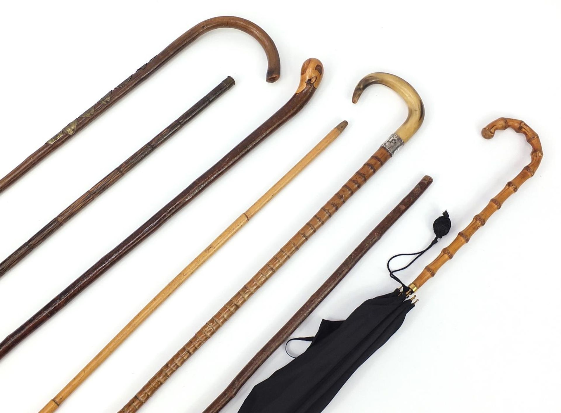 Six walking sticks and a vintage parasol, including two with horn handles and one with silver - Image 2 of 6