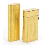 Two gold plated pocket lighters comprising Cartier and Dunhill, the largest 7cm high :For Further
