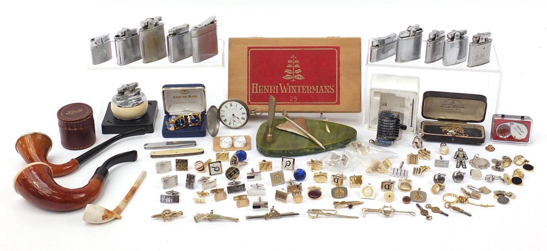 Objects including a Langdon Davies silver pocket watch, lighters, smoking pipes, cufflinks and