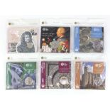 Six Royal Mint uncirculated five and two pound coins comprising four Historic Royal Palaces,