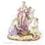 Meissen, 19th century German porcelain figure group of three scantily dressed females and a bull,