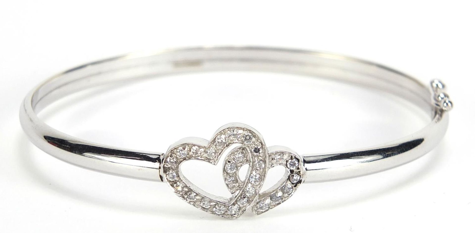 9ct white gold double love heart bangle set with clear stones, 6.5cm wide, 6.2g :For Further