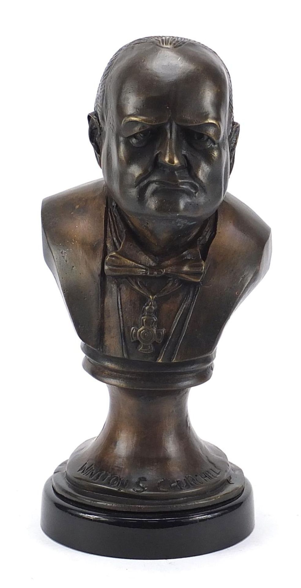 Military interest bronze bust of Winston Churchill raised on a circular ebonised base, 33cm high :