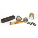 Antique and later silver and objects comprising an amber cheroot with fitted case, matchbox cover,