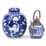 Chinese blue and white porcelain teapot with white metal mounts and a blue and white ginger jar hand