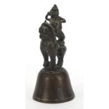 Indian bronze bell in the form of a deity on mythical animal, 12cm high :For Further Condition