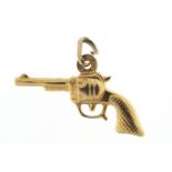 9ct gold revolver pistol charm, 2.4cm in length, 1.1g :For Further Condition Reports Please Visit