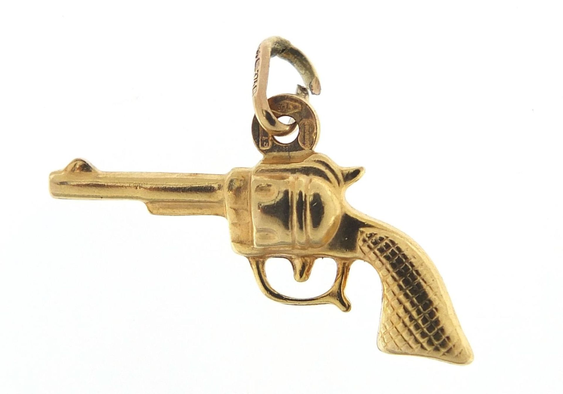 9ct gold revolver pistol charm, 2.4cm in length, 1.1g :For Further Condition Reports Please Visit