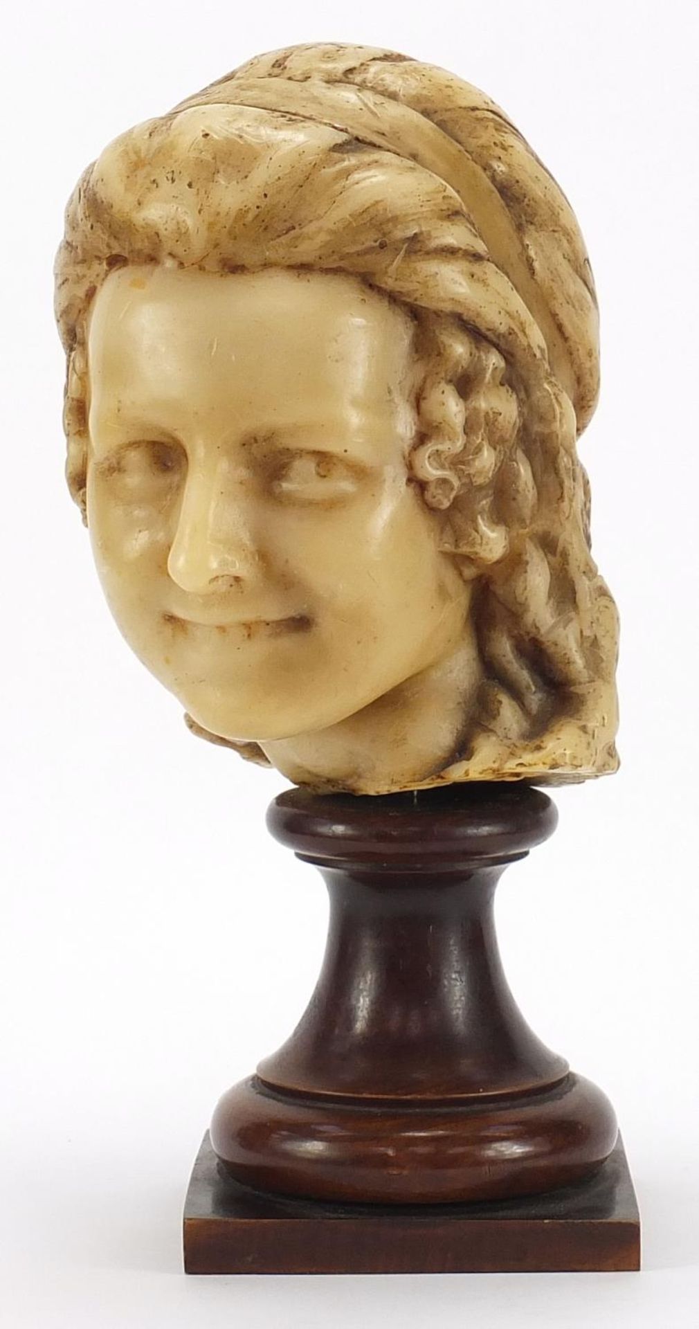 Wax bust of a female raised on turned mahogany pedestal base, 41.5cm high :For Further Condition