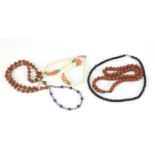 Four necklaces and an amethyst bracelet with 9ct gold clasp including goldstone and carnelian with