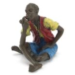 Cold painted bronze figure of a man smoking a pipe in the style of Franz Xaver Bergmann, 6cm high :