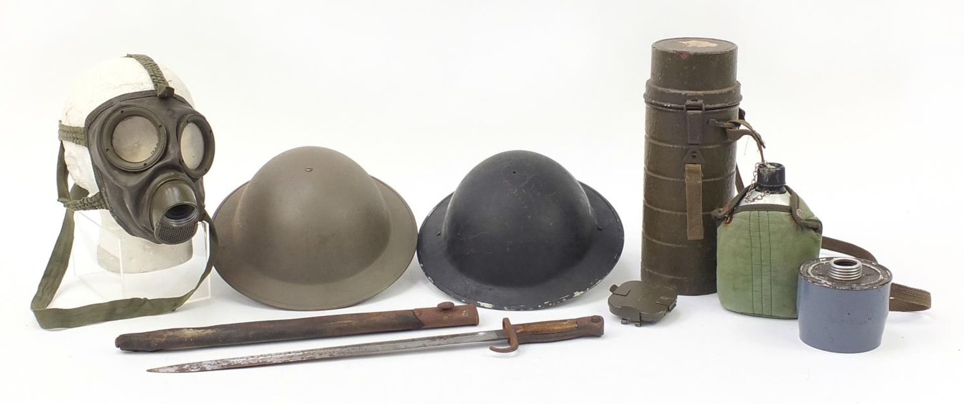 Militaria including a Wilkinson 1907 pattern bayonet with scabbard, flask and two tin helmets :For