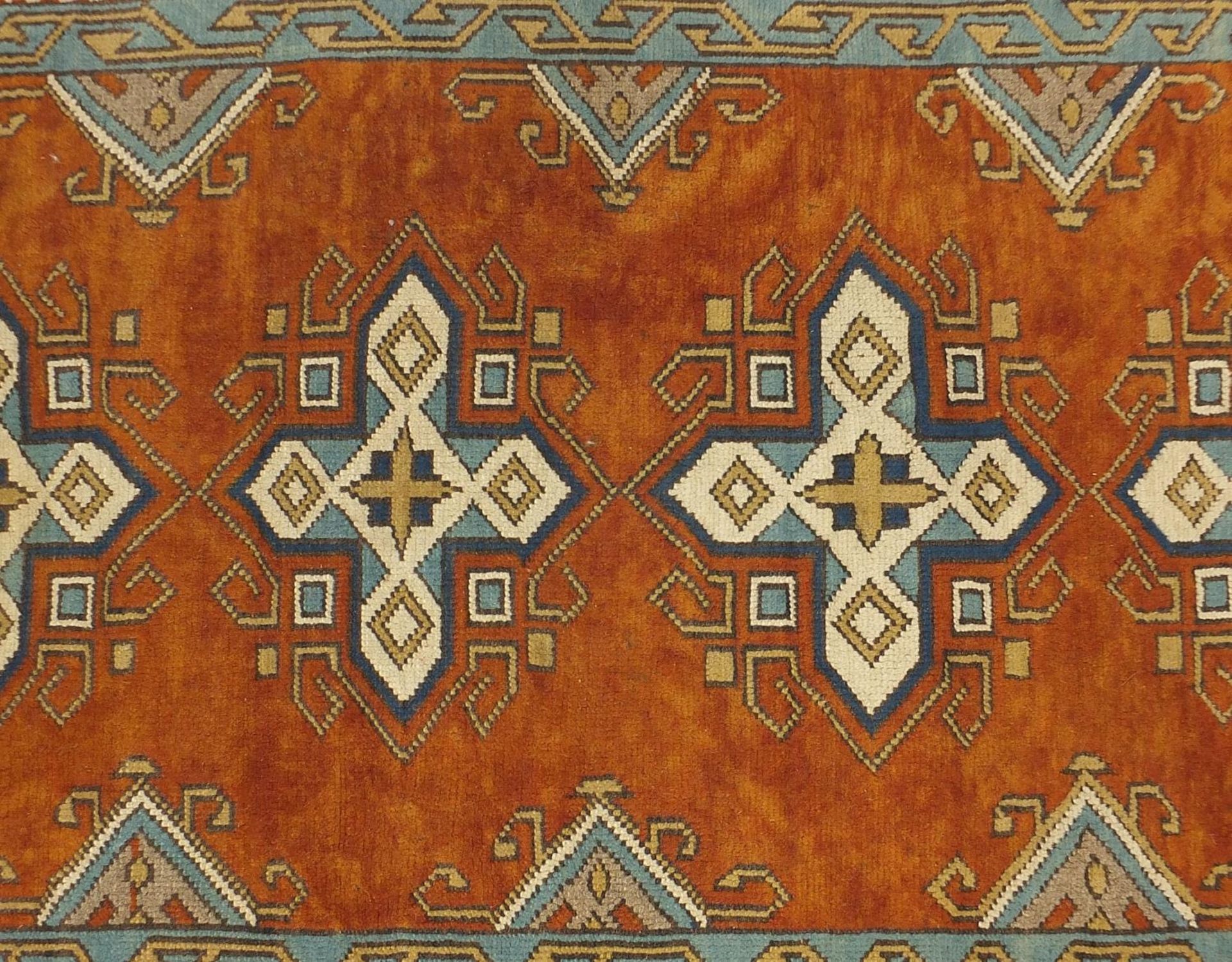Rectangular Persian rug having a floral border onto orange grounds, 303cm x 131cm :For Further - Bild 2 aus 4
