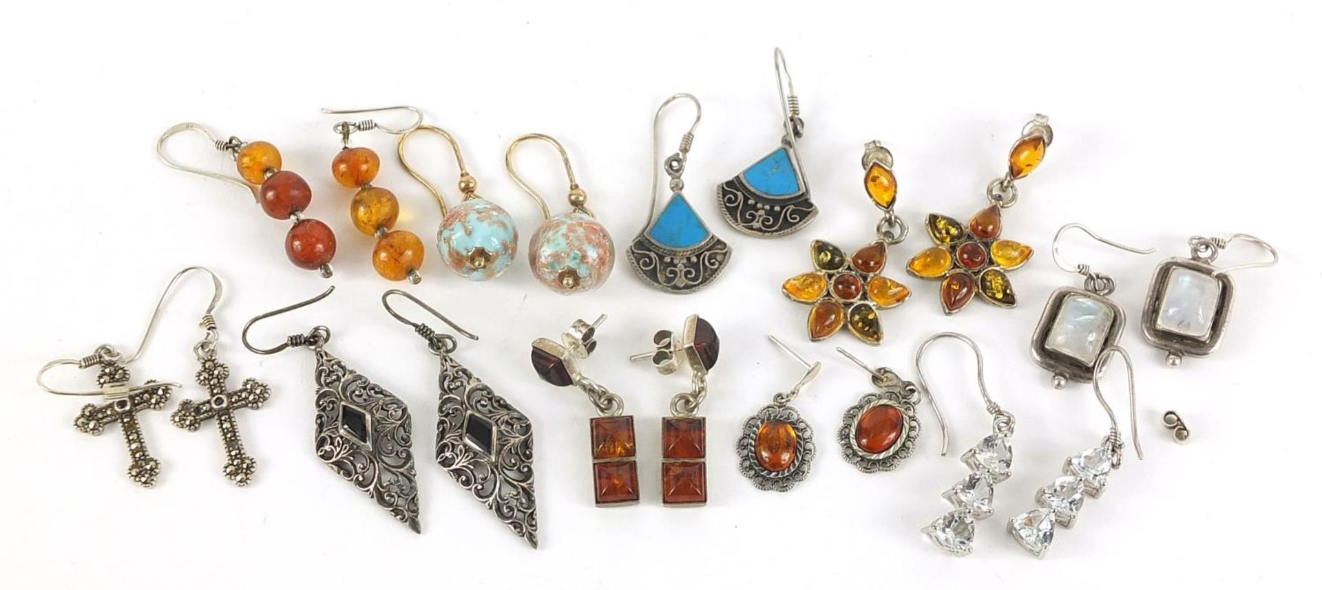 Ten pairs of earrings, some silver, set with semi precious stones including amber, moonstone and