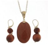 Silver goldstone pendant on a silver necklace with matching earrings, the pendant 5.5cm high,