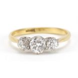 18ct gold diamond trilogy ring, the central diamond approximately 4.7mm in diameter, the smaller