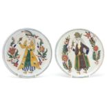 Pair of Turkish Kutahya pottery plates hand painted with figures amongst flowers, each 16cm in