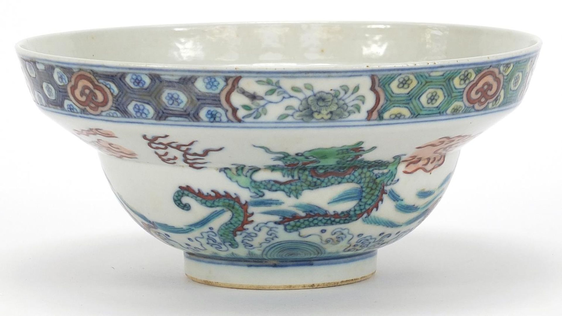 Chinese doucai porcelain bowl hand painted with dragons and fish amongst aquatic life, six figure