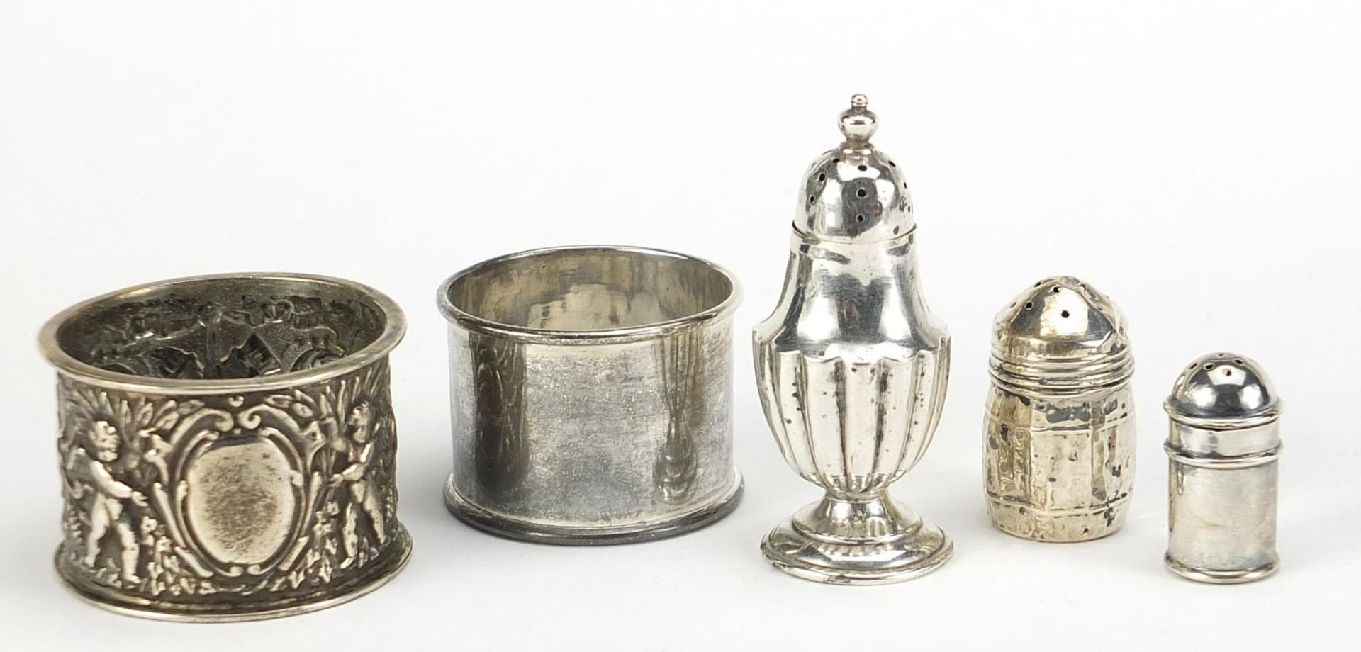 Victorian and later silver objects including a napkin ring embossed with Putti and miniature