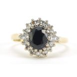 18ct gold sapphire and diamond ring, the round cut diamonds approximately 1.2mm in diameter, size M,
