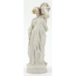19th century parian figurine of a maiden holding a basket, 34cm high :For Further Condition