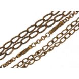 Three Victorian gold plated and brass watch chains with T bars, the largest 42cm in length :For