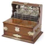 Victorian oak tantalus compendium with metal mounts and carrying handles fitted with three glass