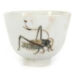 Chinese porcelain tea bowl hand painted with three crickets, iron red character marks to the base,