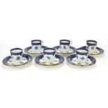 Set of six Coalport blue and white trios decorated with flowers, each cup 6.5cm high :For Further