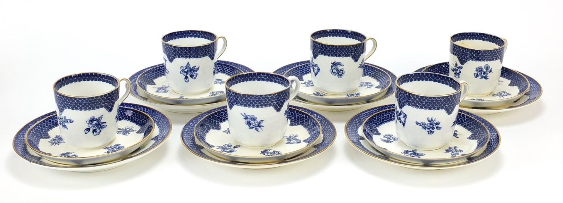 Set of six Coalport blue and white trios decorated with flowers, each cup 6.5cm high :For Further