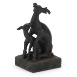 Chinese patinated bronze two piece seal in the form of a deer and foal, character marks to the base,