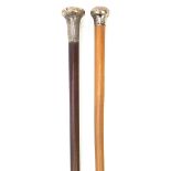 Two walking sticks with silver pommels including one with malacca shaft, the largest 90cm in