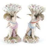 Pair of Continental porcelain Putti and cornucopia design spill vases with floral encrusted bases,