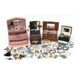 Vintage and later costume jewellery arranged in four cases including rings, jewelled animal