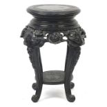 Chinese hardwood stand with under tier carved with flowers, 50cm high x 30cm in diameter :For