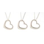 Three silver love heart pendants on silver necklaces, 40cm in length, 9.0g :For Further Condition