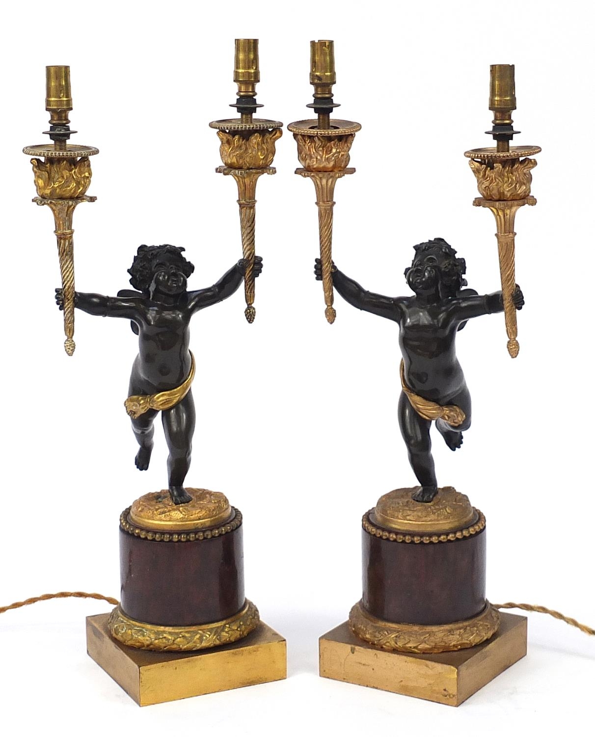 Pair of 19th century ormolu and marble Putti design two branch candelabras converted to electric